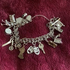 Sterling silver multi charms bracelet Excellent